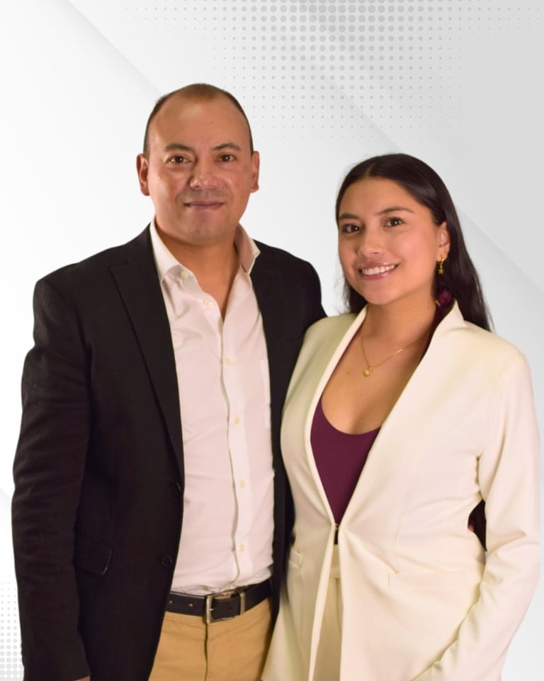 Two professionals posing together for a portrait photo against a light gray background